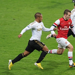 Arsenal's Jack Wilshere Goes Head-to-Head with Swansea's Ashley Richards and Leon Britton in FA Cup Clash