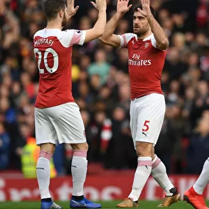 Arsenal's Sokratis and Mustafi Share a Moment Before the Arsenal v Tottenham Clash