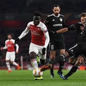 Bukayo Saka vs. Donald Guerrier: A Football Showdown at Emirates Stadium - Arsenal vs. Qarabag, UEFA Europa League
