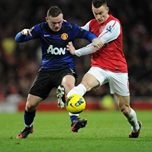 Intense Battle: Koscielny Tackles Rooney in Arsenal vs Manchester United