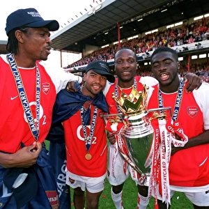 Kanu, Ashley Cole, Lauren and Kolo Toure (Arsenal) with the Premiership Trophy