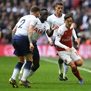 Mesut Ozil Clashes with Triple Threat: Tripper, Sanchez, and Lamela in Intense Tottenham-Arsenal Rivalry