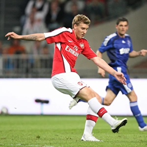 Nicklas Bendtner shoots past Maarten Stekelenburg to