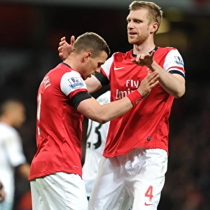 Podolski and Mertesacker: Arsenal's Unstoppable Duo Celebrates First Goal in 3:1 Victory over West Ham