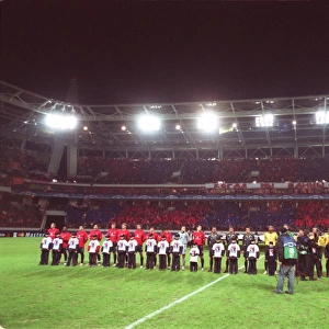 The two teams line up before the match