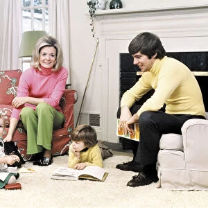 Family reading in living room