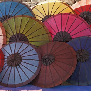 Laos, Northern Laos, Luang Prabang (Luang Phabang), colourful parasols for sale on the main street