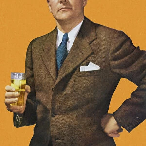 Man in Suit Holding Beverage