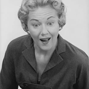 Studio shot of mid adult woman with facial expression