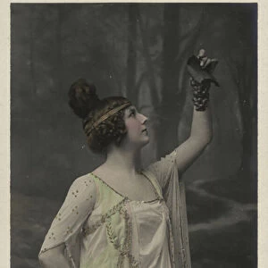 Woman with bunch of grapes (colour photo)