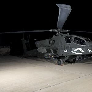 An AH-64D Apache Longbow at night, Tikrit, Iraq
