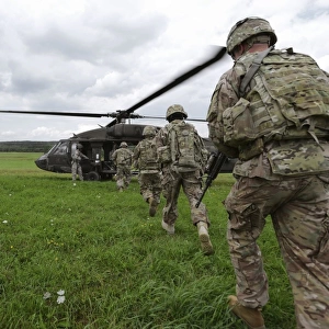 U. S. Army soldiers board a UH-60 Black Hawk helicopter