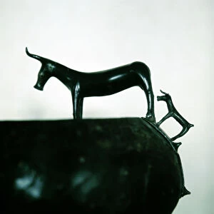 Detail of Celtic bronze bowl showing a cow and calf, Hallstatt, Austria, 6th century BC