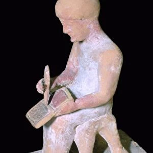 Greek terracotta of a man writing