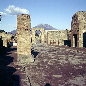 Road leading to Arch of Caligula with Vesuvius beyond, Pompeii, Italy