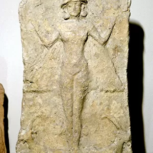 Terracotta relief of the goddess Astarte (Inanna) standing on two animals