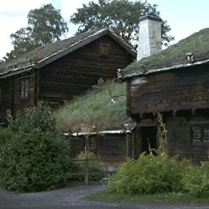 Traditional Swedish farm building with a turf roof
