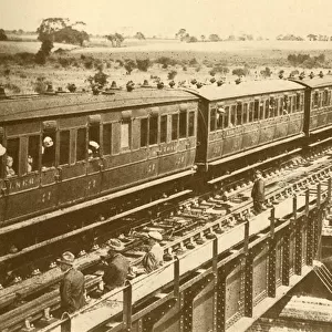 A Train Passing Over The Bridge, c1930. Creator: Unknown