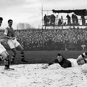 Jack Kelsey sprawled in the sawdust watches the ball enter the net for Bedford's only goal scored by Harry Yates, behind Charlton on the left