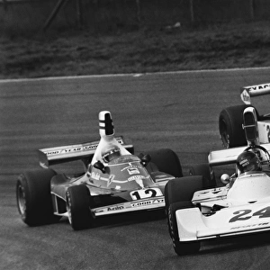 1975 Dutch Grand Prix: James Hunt, 1st position, leads Niki Lauda, 2nd position and Jochen Mass, retired, action