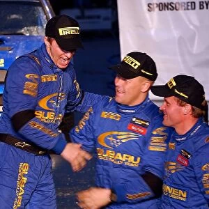 World Rally Championship: Subaru team mates Petter Solberg, Kaj Lindstrom and Tommi Makinen celebrate on the podium