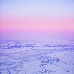 Aerial View Of The Kobuk River And Waring Mountains Just Before Sunrise During Winter Near Noatak, Arctic Alaska