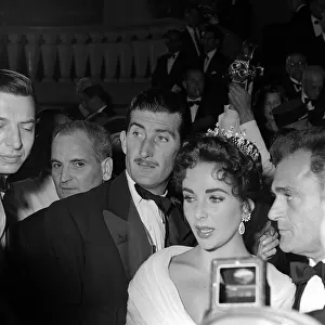 Elizabeth Taylor and husband Mike Todd (R) leaving the Opening Night at Cannes Film