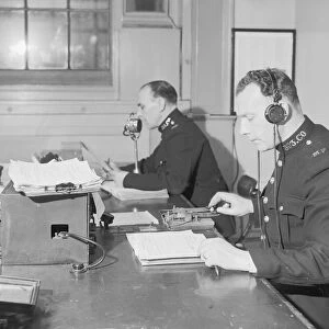 Radio and telegraph officers on duty in Scotland Yards information room