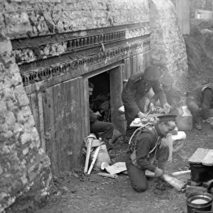 Royal Marines preparing a meal at the earthwork defences