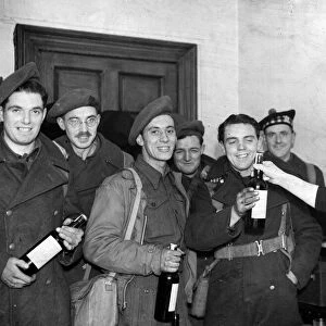 Second World War January 1945 Servicemen on leave receive bottle of whisky