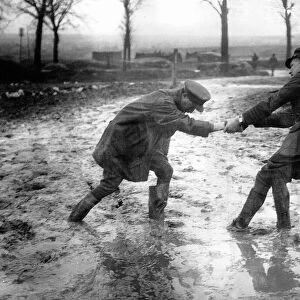 World War One. A British officer helps a fellow officer who